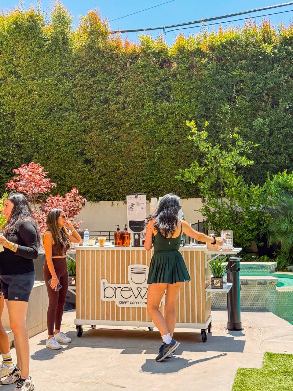 Guests enjoying BrewJoy coffee service at an outdoor event