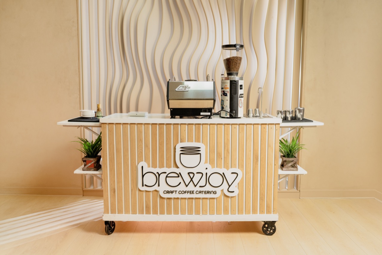 BrewJoy mobile coffee cart serving guests at a wedding in San Diego