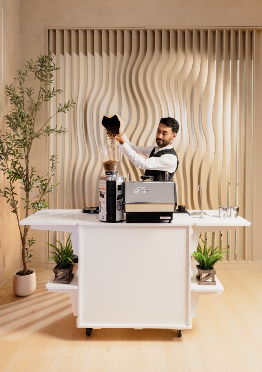 Professional barista pulling espresso shots at a corporate event in Southern California
